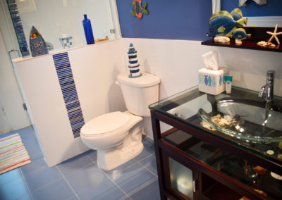 Pool Bath, Porcelain features and glass vanity